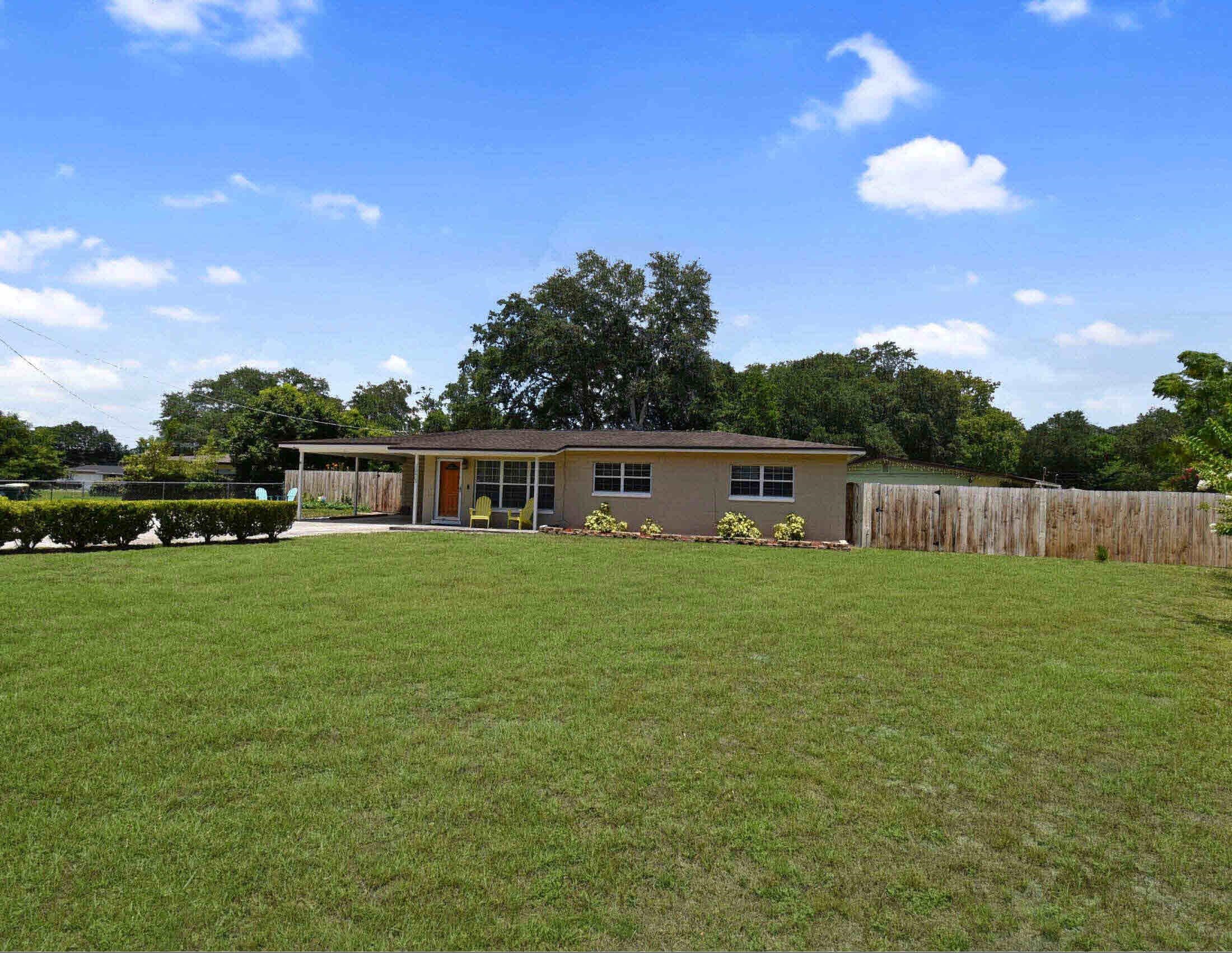 10403 Ebbitt Road Jacksonville, FL 32246 - Photo 2 of 22 a front view of a house with garden