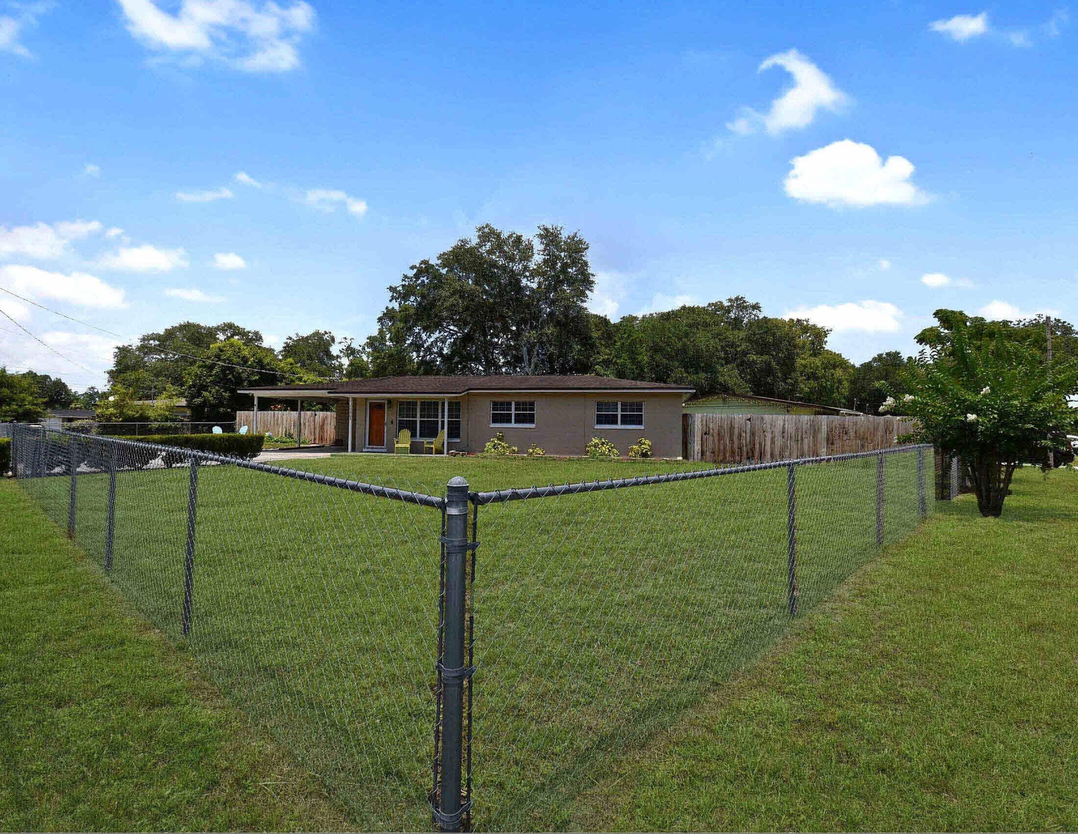 10403 Ebbitt Road Jacksonville, FL 32246 - Photo 4 of 22 a view of a big house with a big yard