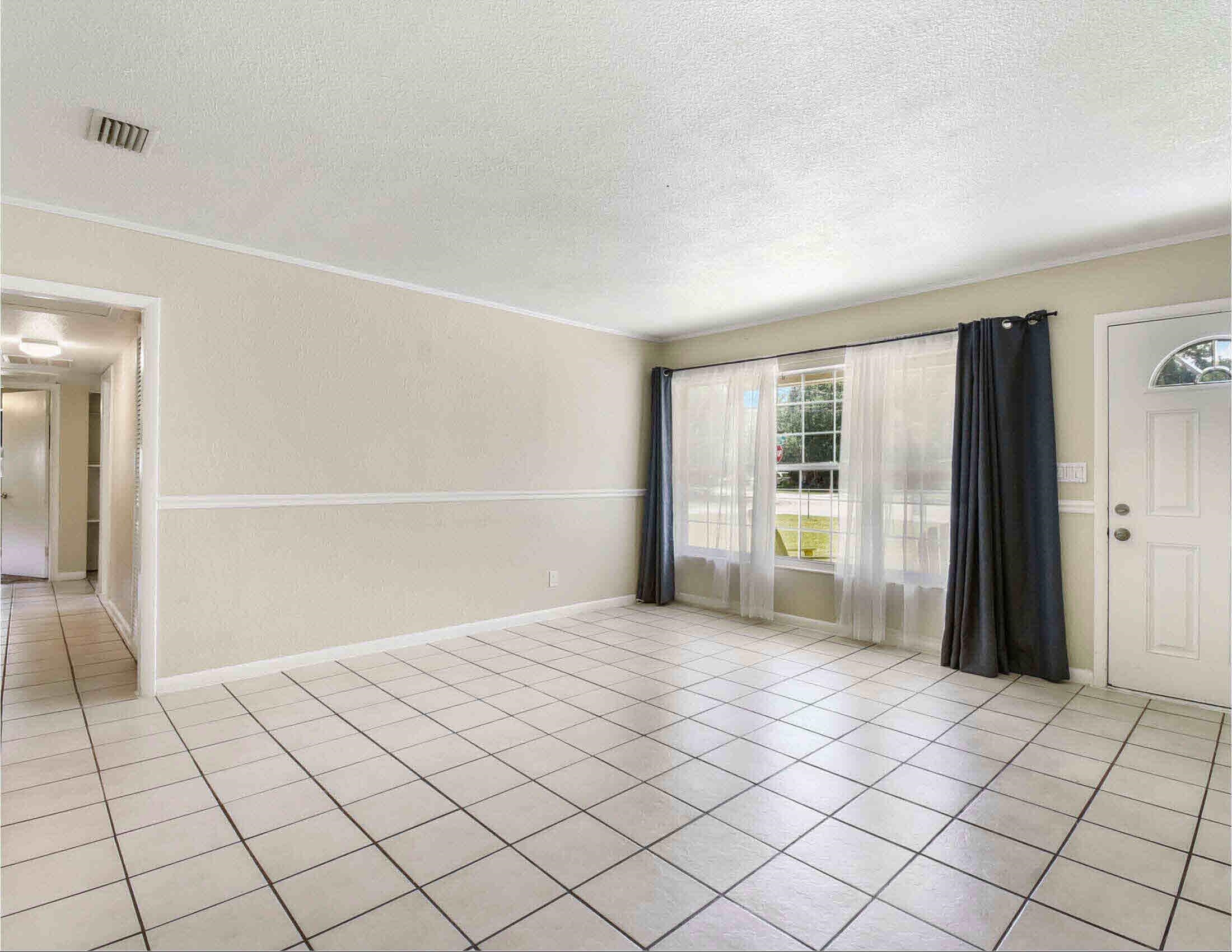 10403 Ebbitt Road Jacksonville, FL 32246 - Photo 7 of 22 a view of an empty room and window