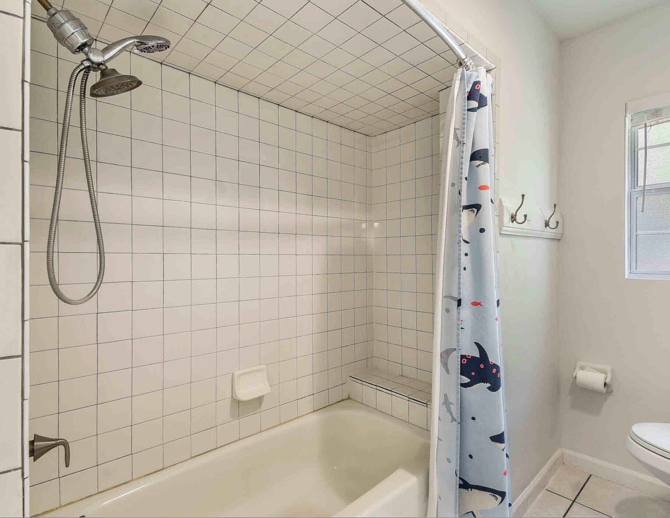 10403 Ebbitt Road Jacksonville, FL 32246 - Photo 10 of 22 a bathroom with a bathtub and a shower