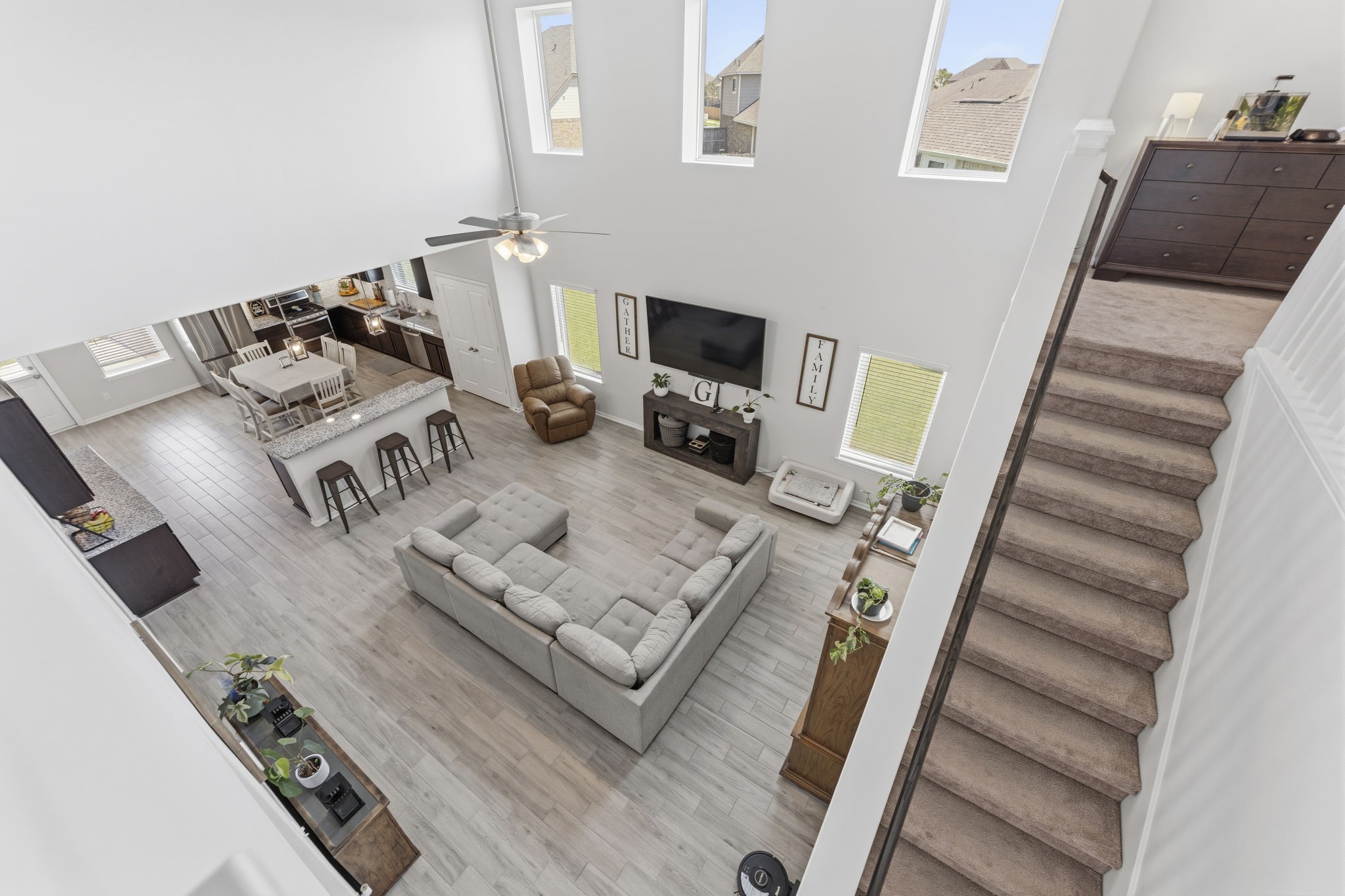 2401 Abbot Brk Drive Rosharon, TX 77583 - Photo 25 of 50 The centrally located staircase offers convenient access to the upper level and enhances the home’s flowing layout. Upstairs, you will find three bedrooms, 2 baths (1 private) and a spacious game room.