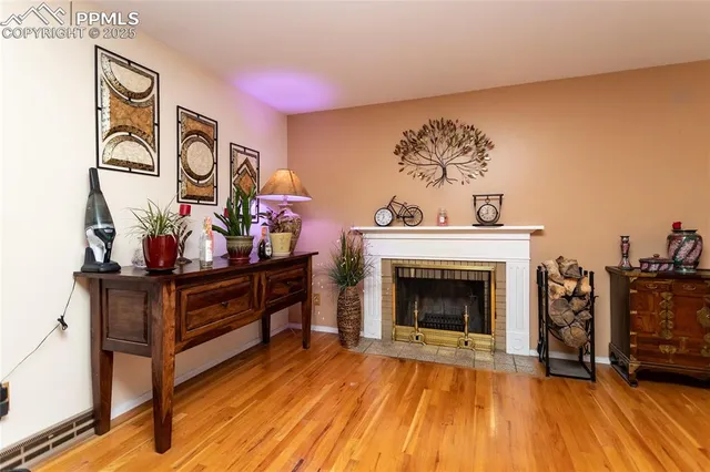 a living room with furniture and fireplace
