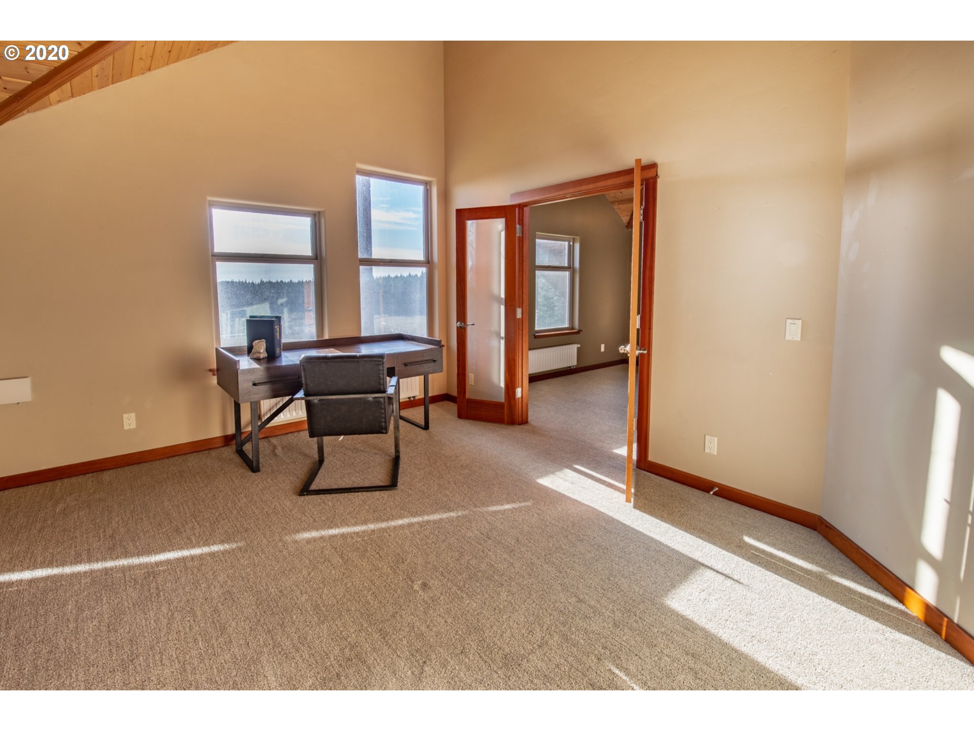 71 Tunnel Road White Salmon, WA 98672 - Photo 23 of 28 a living room with furniture and a large window