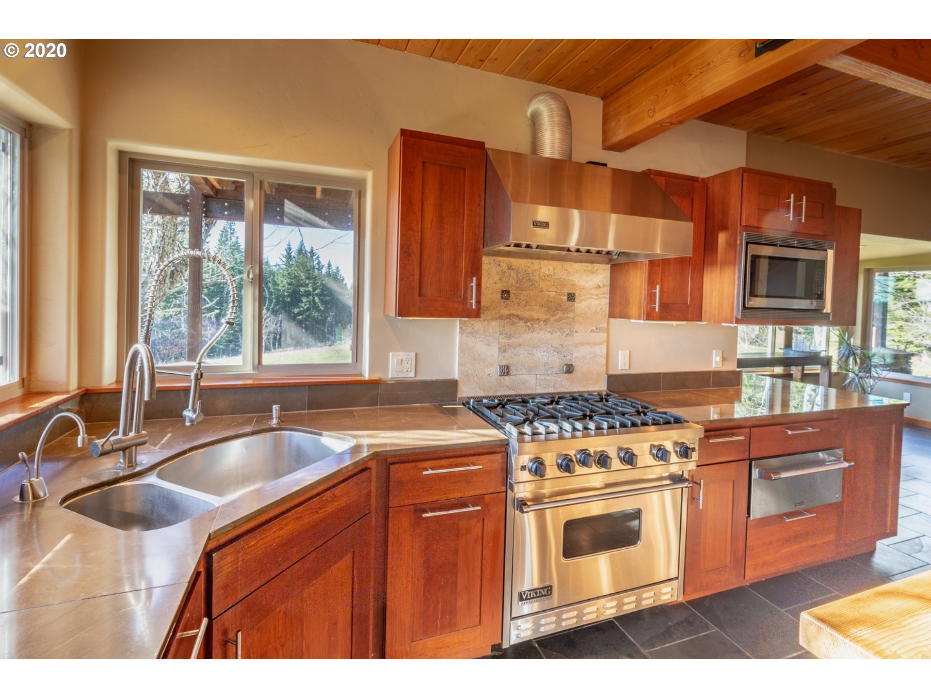 71 Tunnel Road White Salmon, WA 98672 - Photo 9 of 28 a kitchen with stainless steel appliances granite countertop a sink stove and refrigerator