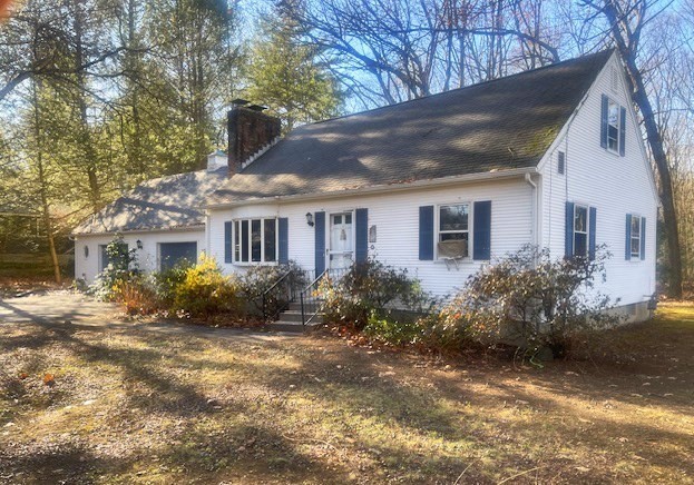 a view of a house with a yard and plants