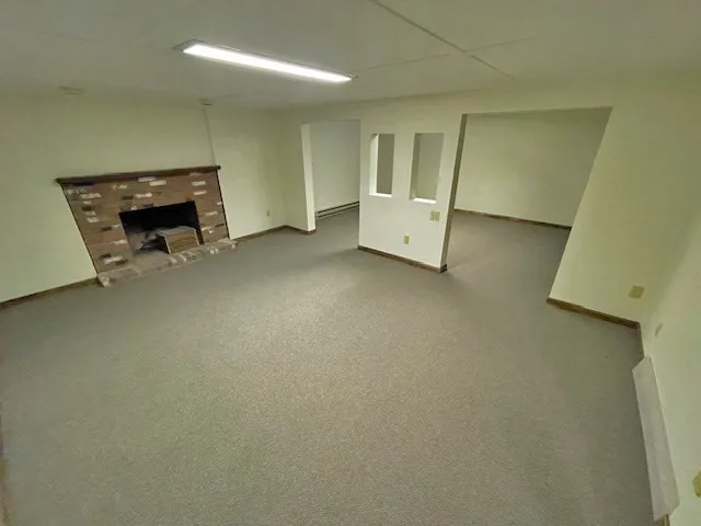 an empty room with a fireplace