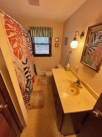 a bathroom with a sink and mirror