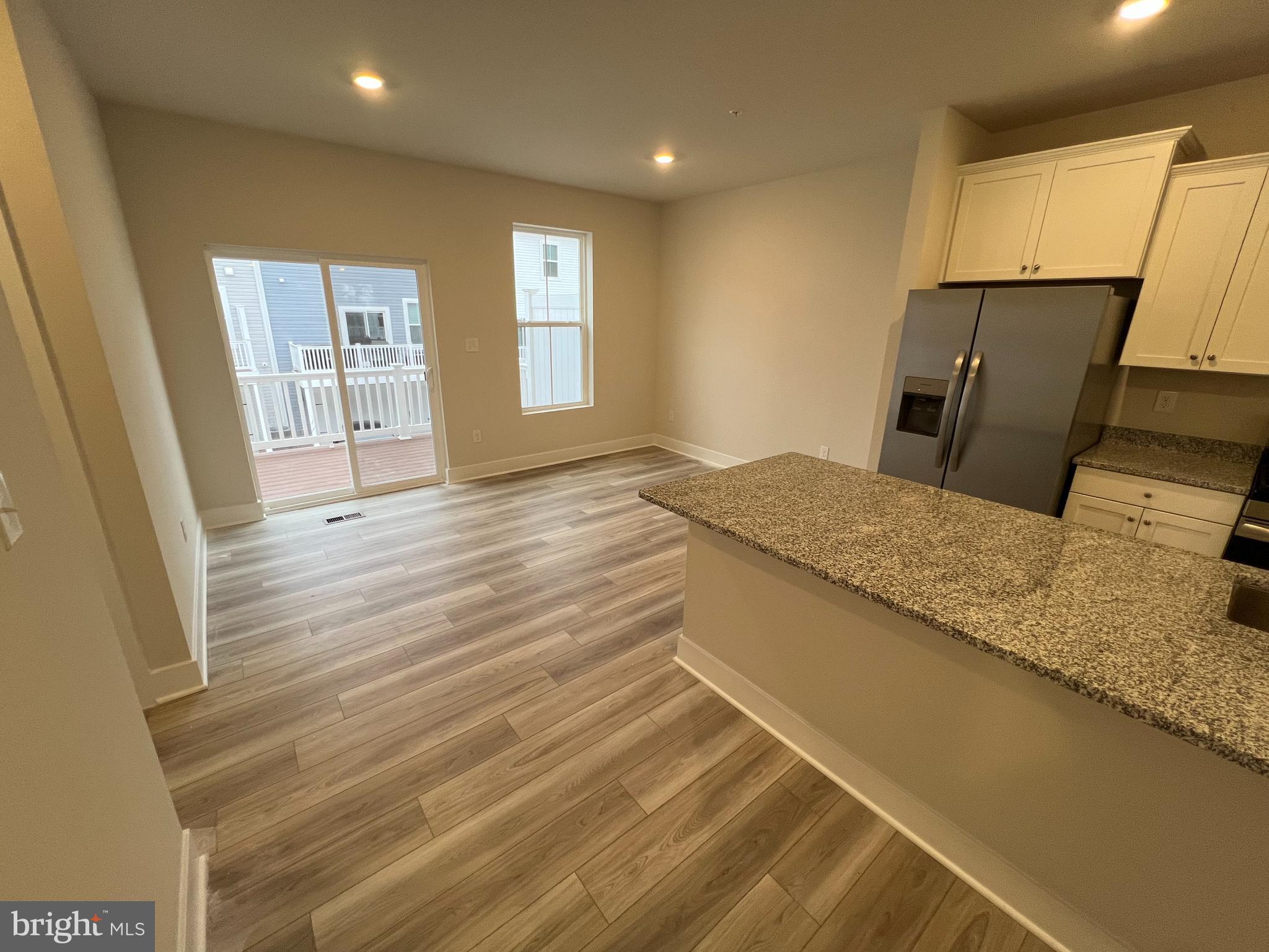 7232 Contee Road Laurel, MD 20707 - Photo 6 of 8 a view of kitchen and wooden floor