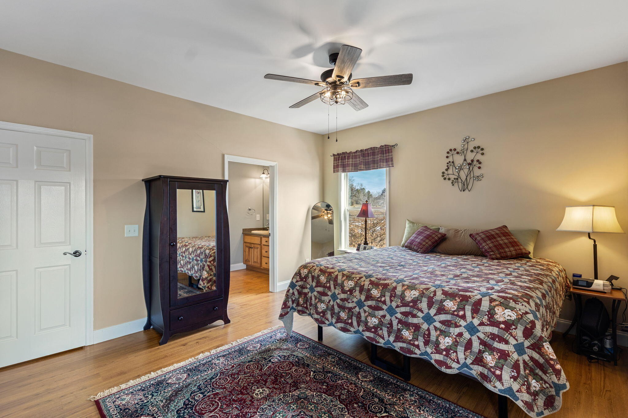 759 Pinhook Road Calhoun, TN 37309 - Photo 27 of 70 a bedroom with a bed and a chandelier