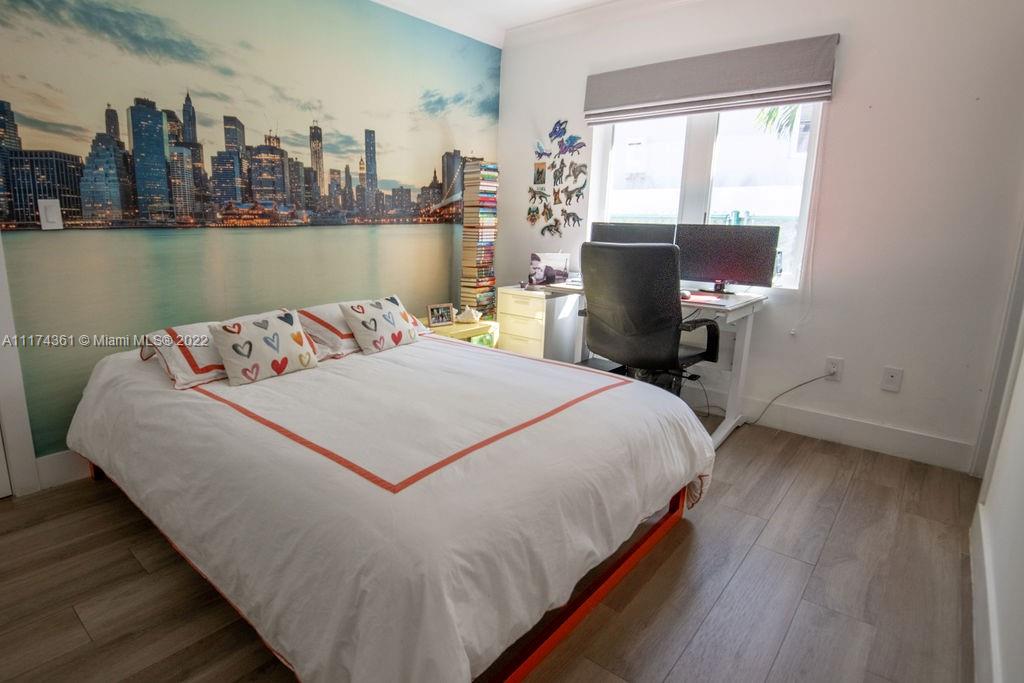 452 Woodcrest Road Key Biscayne, FL 33149 - Photo 18 of 23 a bedroom with a bed and window