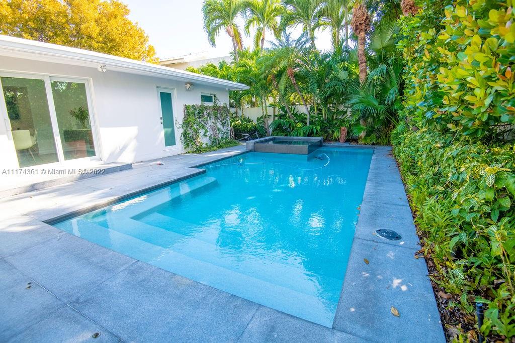 452 Woodcrest Road Key Biscayne, FL 33149 - Photo 20 of 23 a view of a backyard