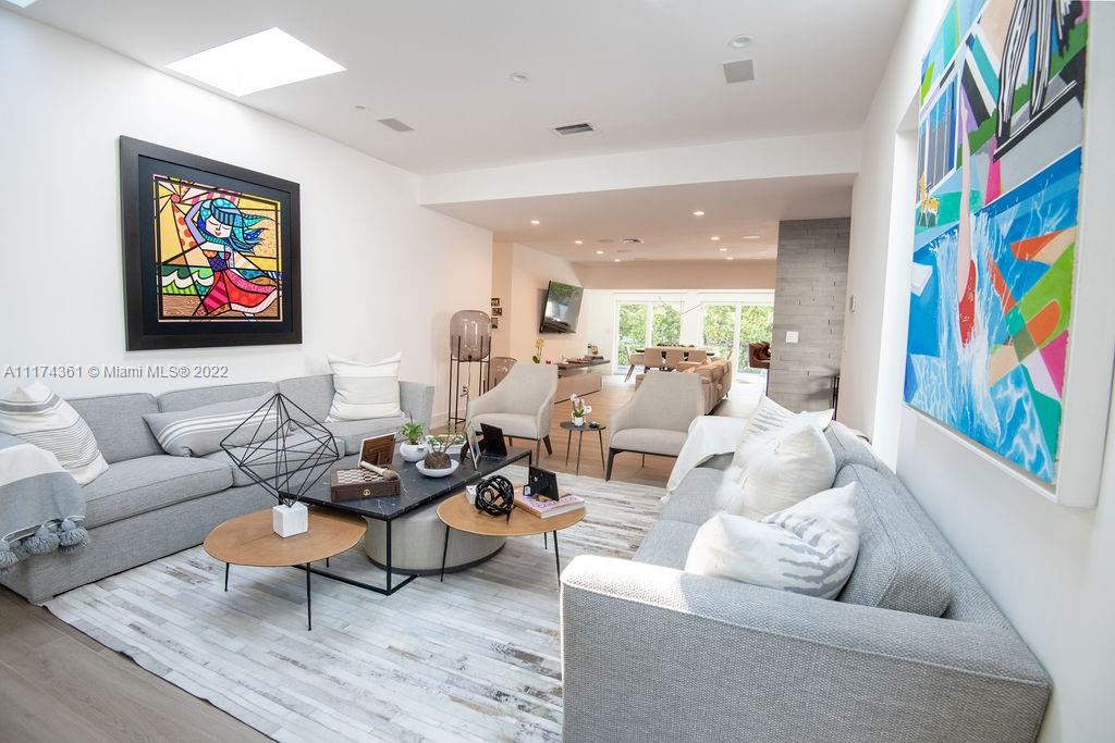 452 Woodcrest Road Key Biscayne, FL 33149 - Photo 2 of 23 a living room with furniture and painting on the wall