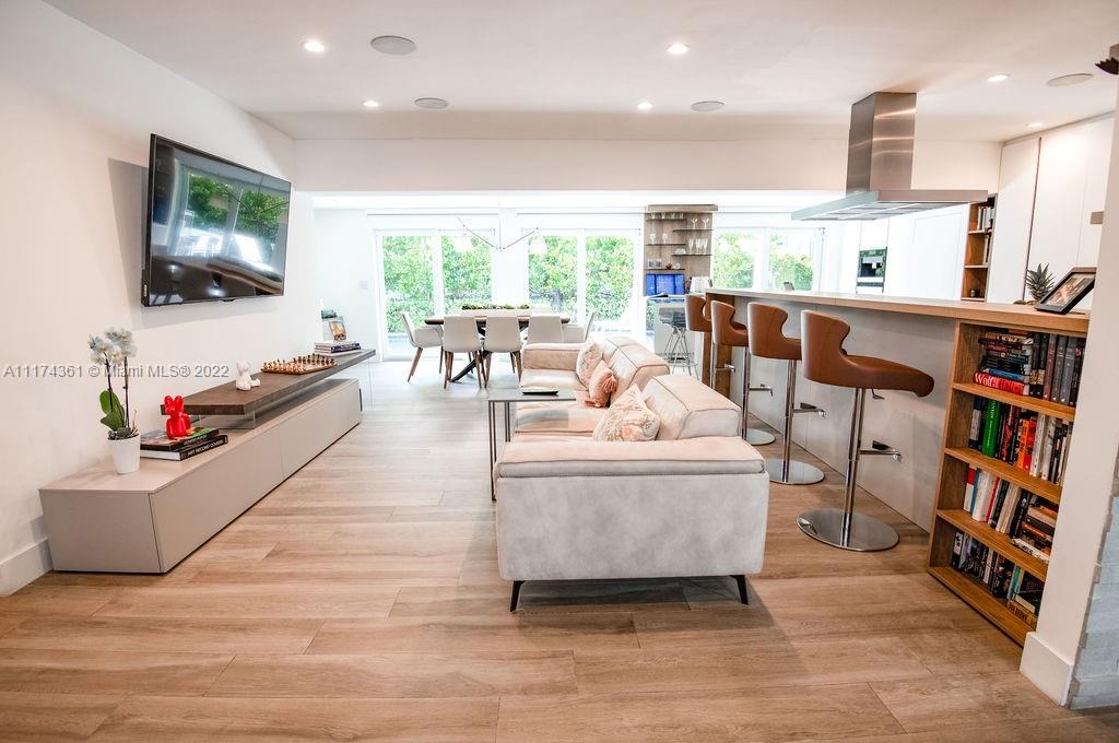 452 Woodcrest Road Key Biscayne, FL 33149 - Photo 4 of 23 a living room with furniture and a flat screen tv