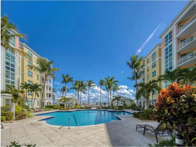 a swimming pool with outdoor seating and yard