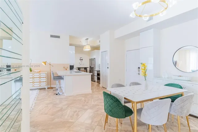 a living room with furniture and a dining table