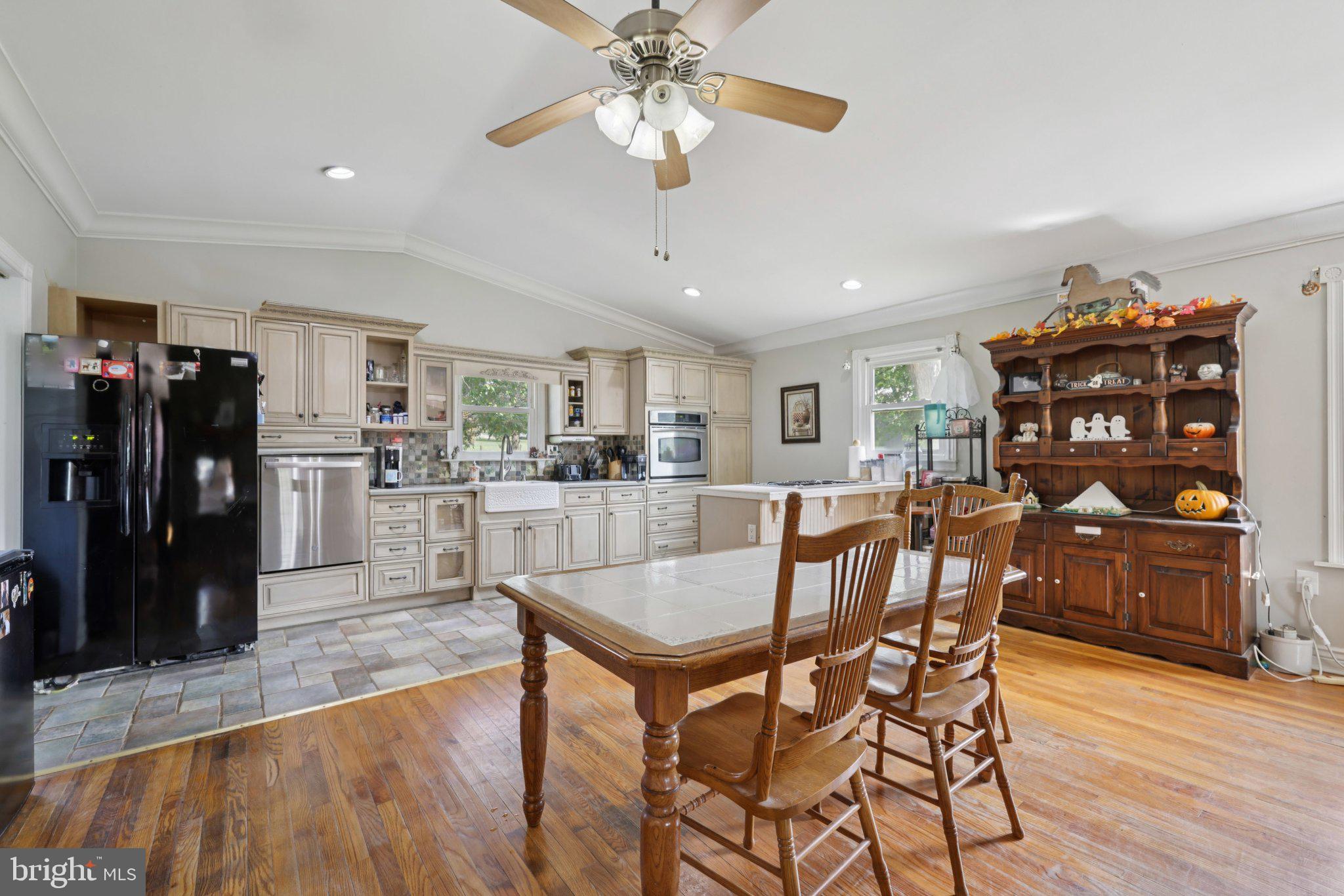 2636 Marston Road New Windsor, MD 21776 - Photo 10 of 107 a dining room with furniture and wooden floor