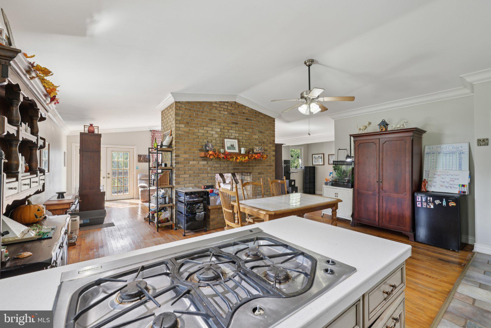 2636 Marston Road New Windsor, MD 21776 - Photo 11 of 107 Kitchen view to DR and 2 sided Fireplace