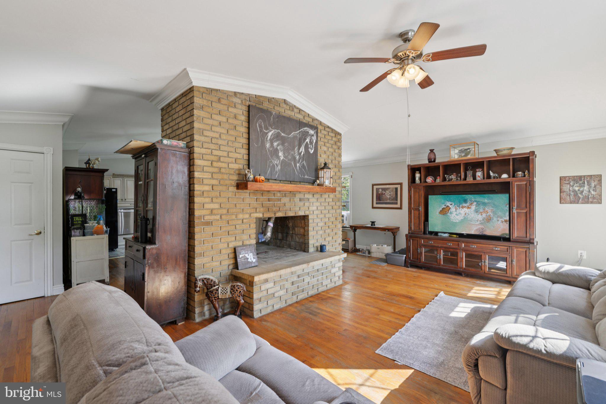 2636 Marston Road New Windsor, MD 21776 - Photo 12 of 107 a living room with furniture and a flat screen tv