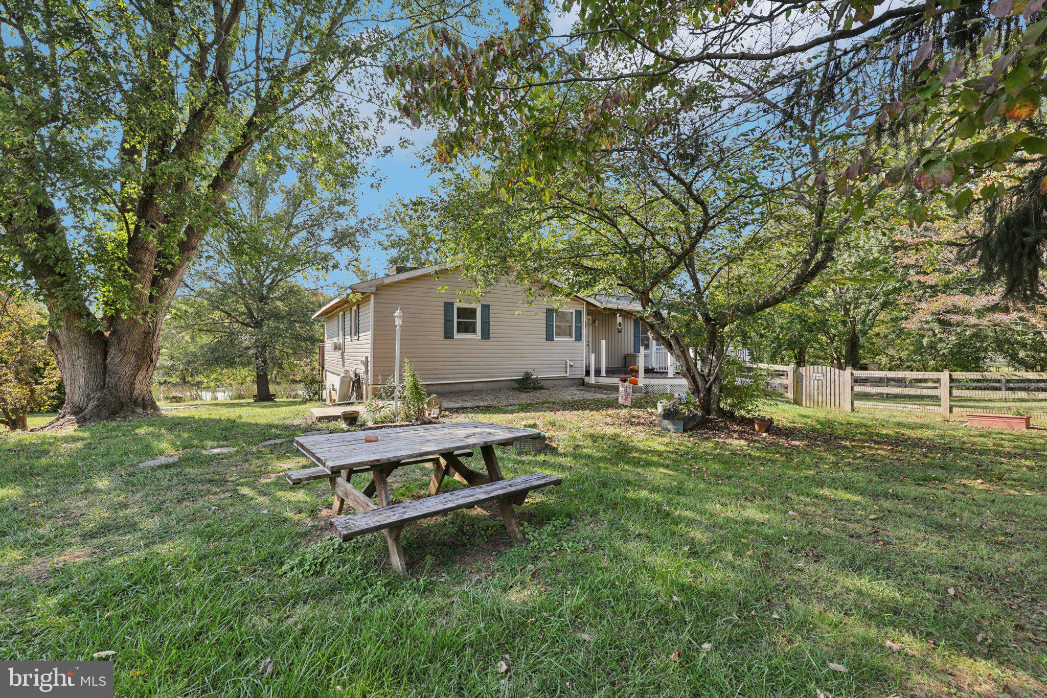 2636 Marston Road New Windsor, MD 21776 - Photo 3 of 107 a view of backyard with a table and chairs