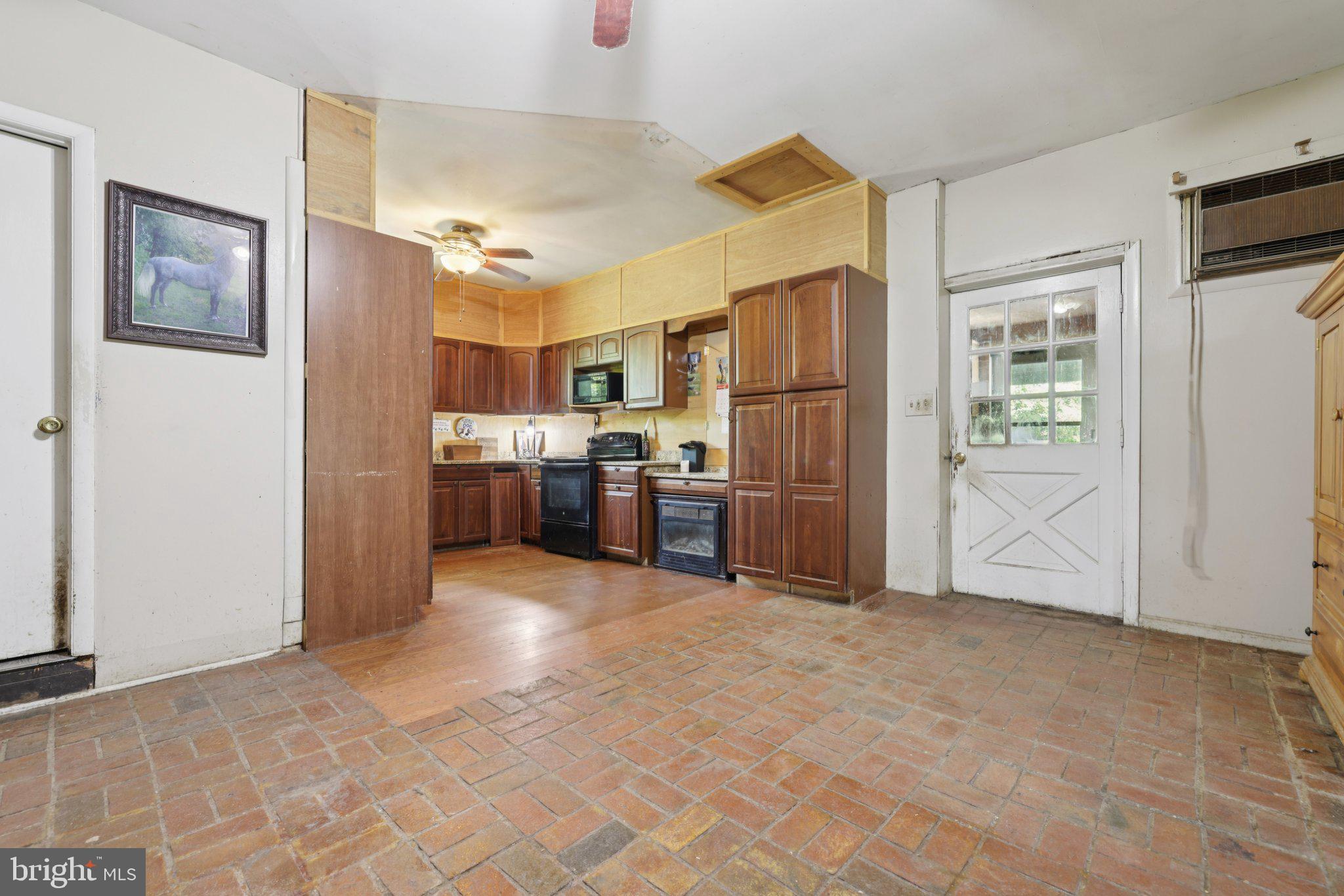 2636 Marston Road New Windsor, MD 21776 - Photo 47 of 107 a kitchen with stainless steel appliances a refrigerator and a stove top oven