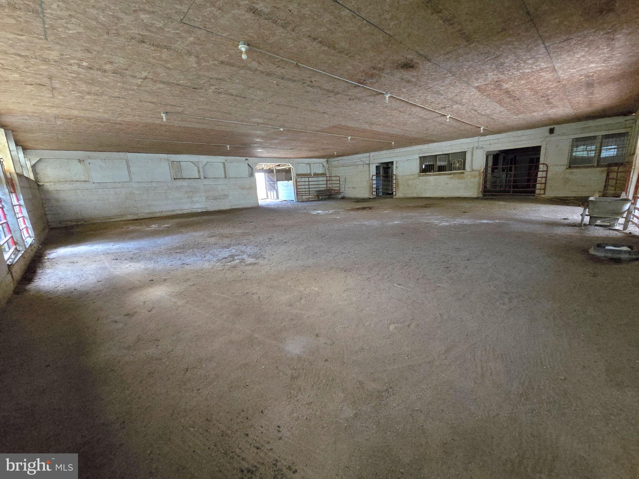 2636 Marston Road New Windsor, MD 21776 - Photo 82 of 107 Stall 9 view across indoor to exit to paddock