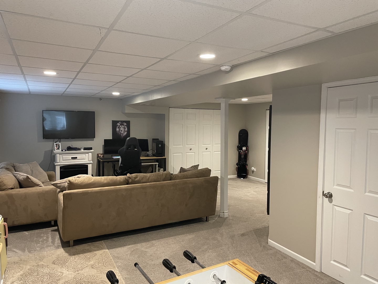1841 Butterfield Road Woodstock, IL 60098 - Photo 25 of 26 a living room with furniture and a flat screen tv