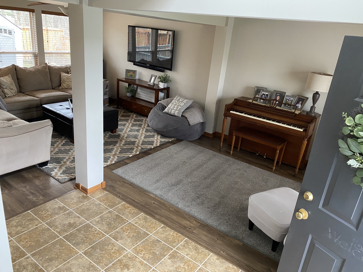 1841 Butterfield Road Woodstock, IL 60098 - Photo 3 of 26 a living room with furniture and a flat screen tv