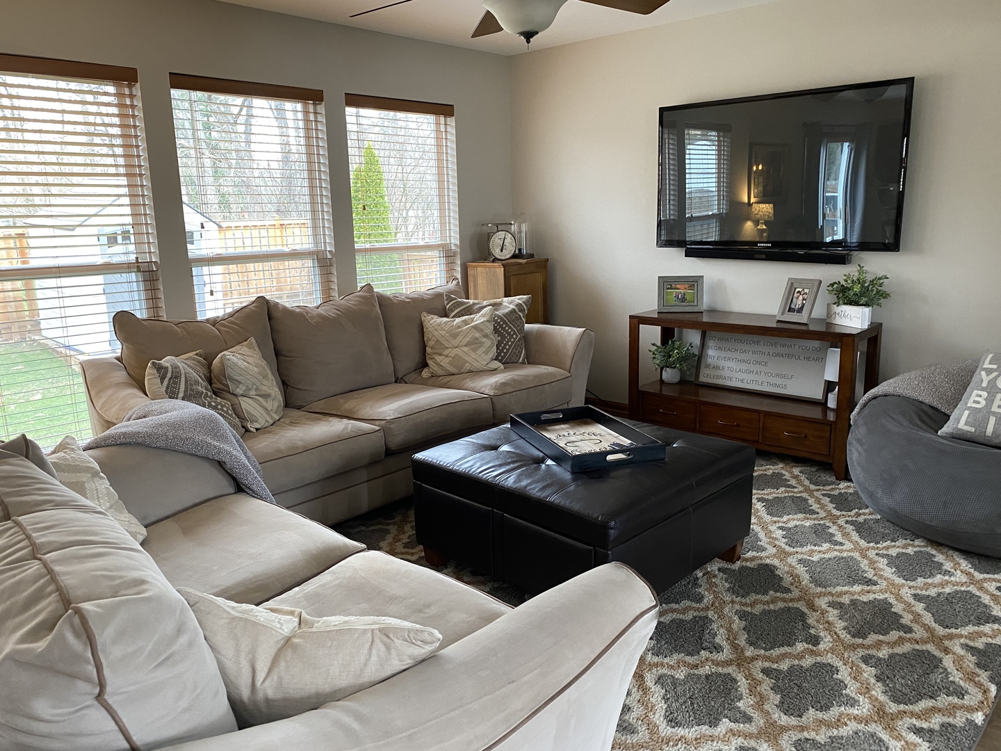 1841 Butterfield Road Woodstock, IL 60098 - Photo 5 of 26 a living room with furniture and a flat screen tv