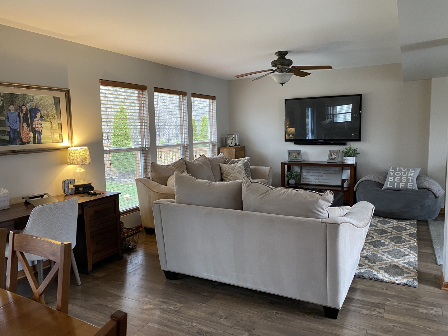 1841 Butterfield Road Woodstock, IL 60098 - Photo 8 of 26 a living room with furniture and a flat screen tv
