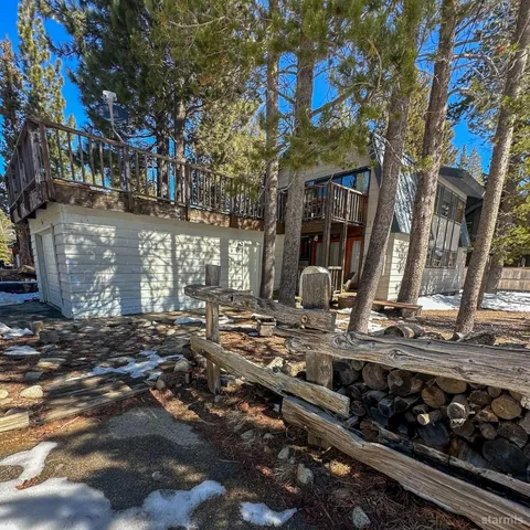 a view of a house with a tree
