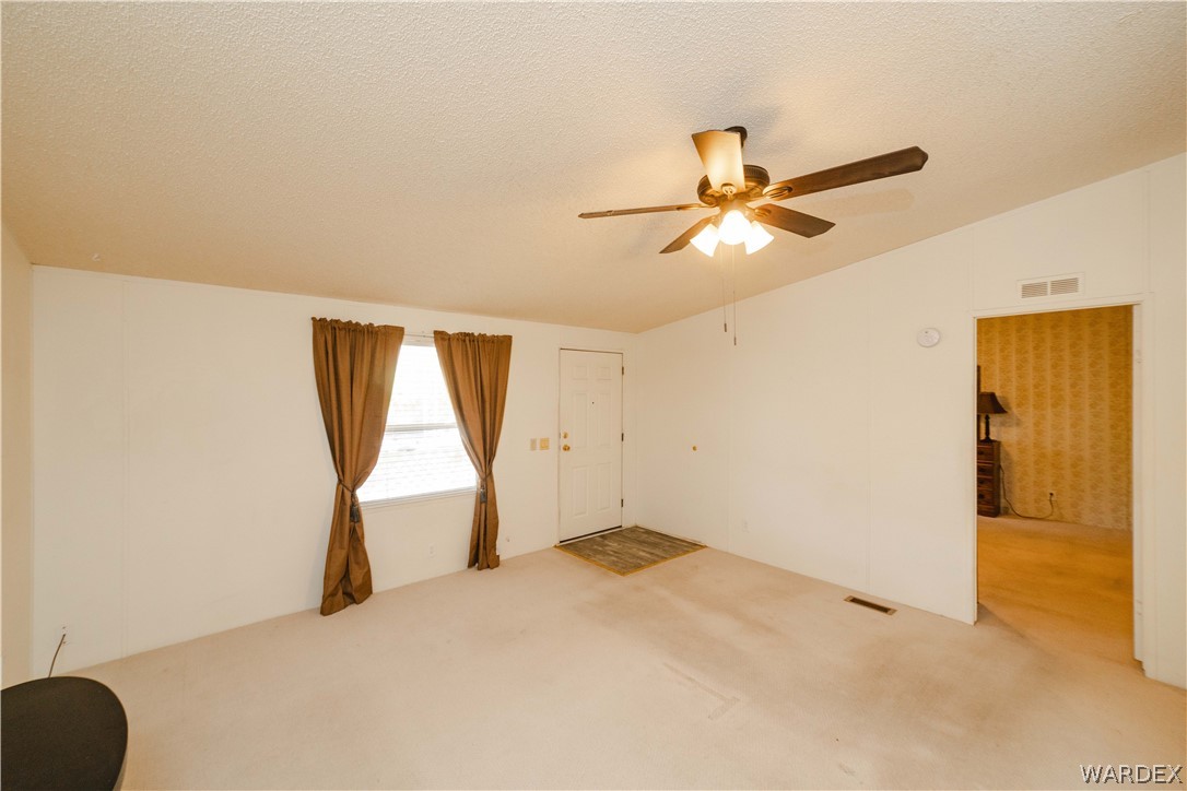 3003 Hualapai Mountain Road Kingman, AZ 86401 - Photo 8 of 49 a view of room with a ceiling fan and a window
