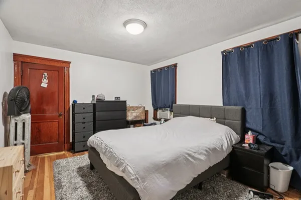 a bedroom with a bed and furniture