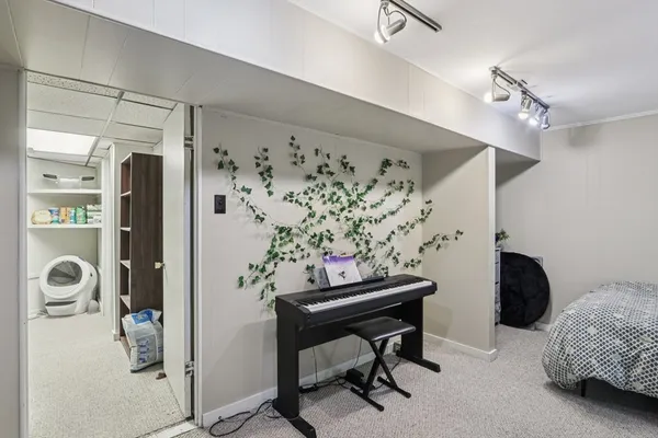 a bedroom with furniture and a window