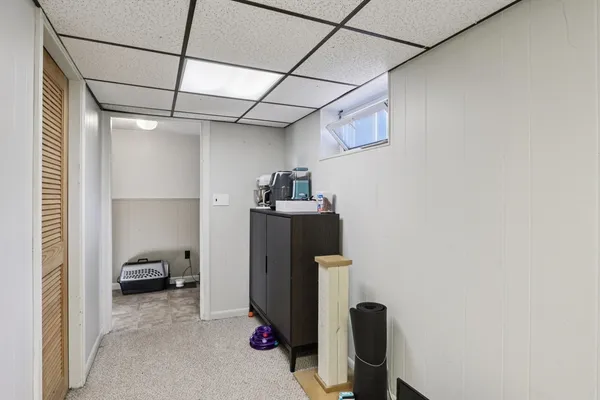 a view of a storage and utility room with utility room