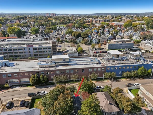 an aerial view of a city with lots of residential buildings