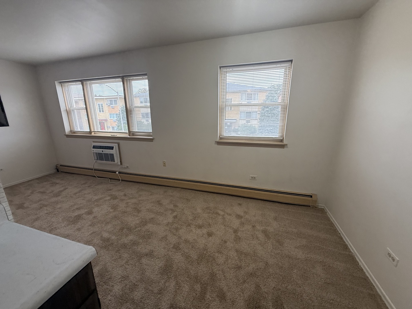 3001 Thatcher Avenue, Unit 5D River Grove, IL 60171 - Photo 6 of 11 an empty room with windows
