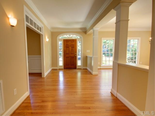 206 Avon Drive Raleigh, NC 27608 - Photo 2 of 12 Generous Foyer with Sidelights Surrounding Front Door. Foyer