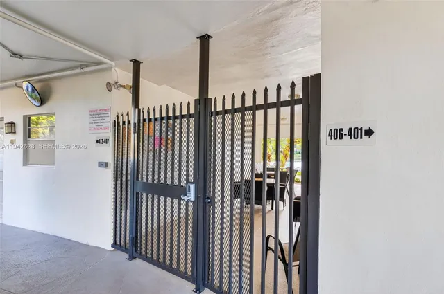 a view of staircase with railing and a window