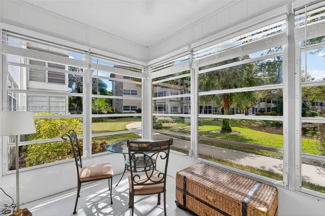 a view of two chairs in the balcony