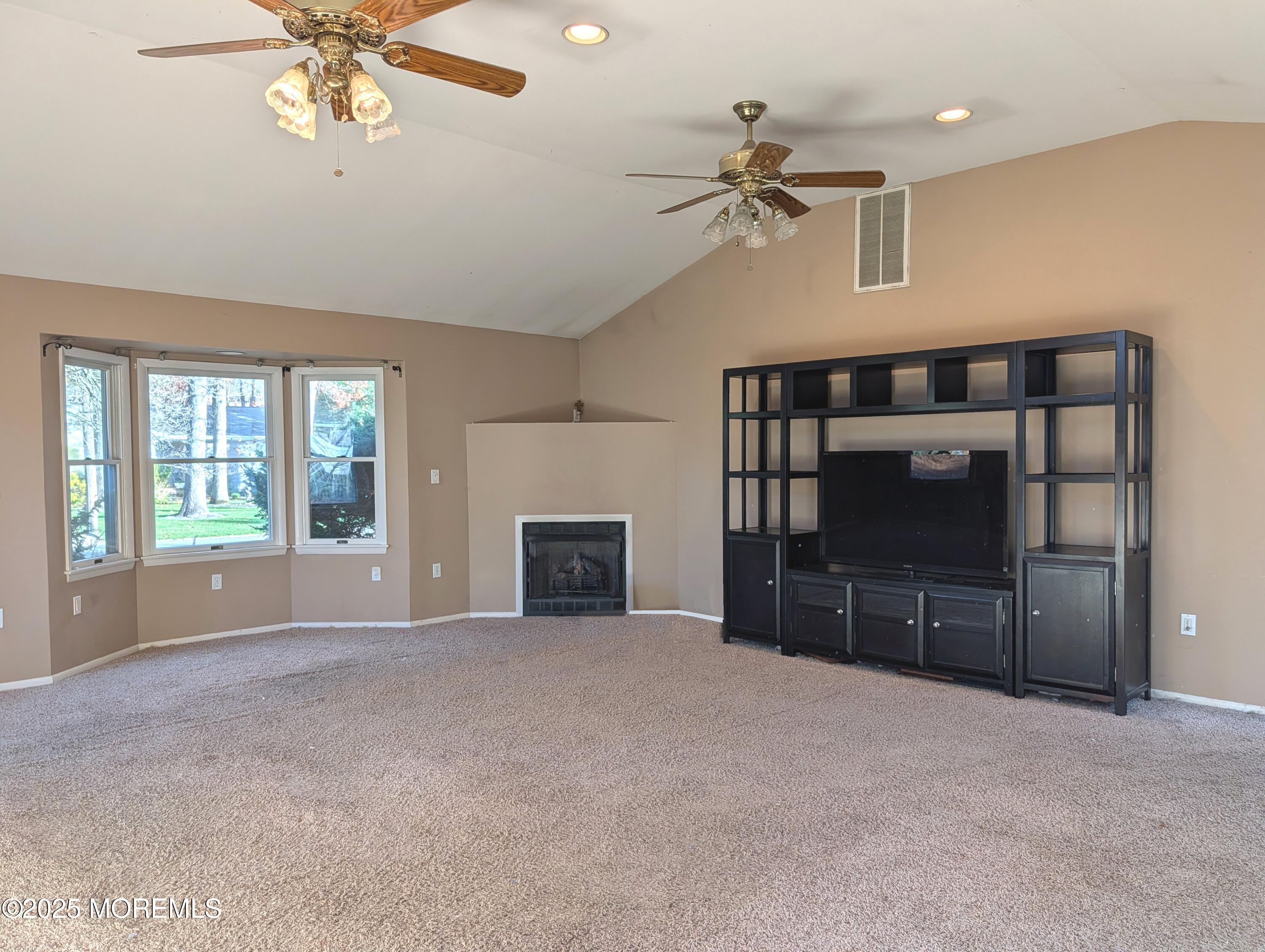 318 Eleanor Road Forked River, NJ 08731 - Photo 12 of 13 a view of a livingroom with furniture and a ceiling fan