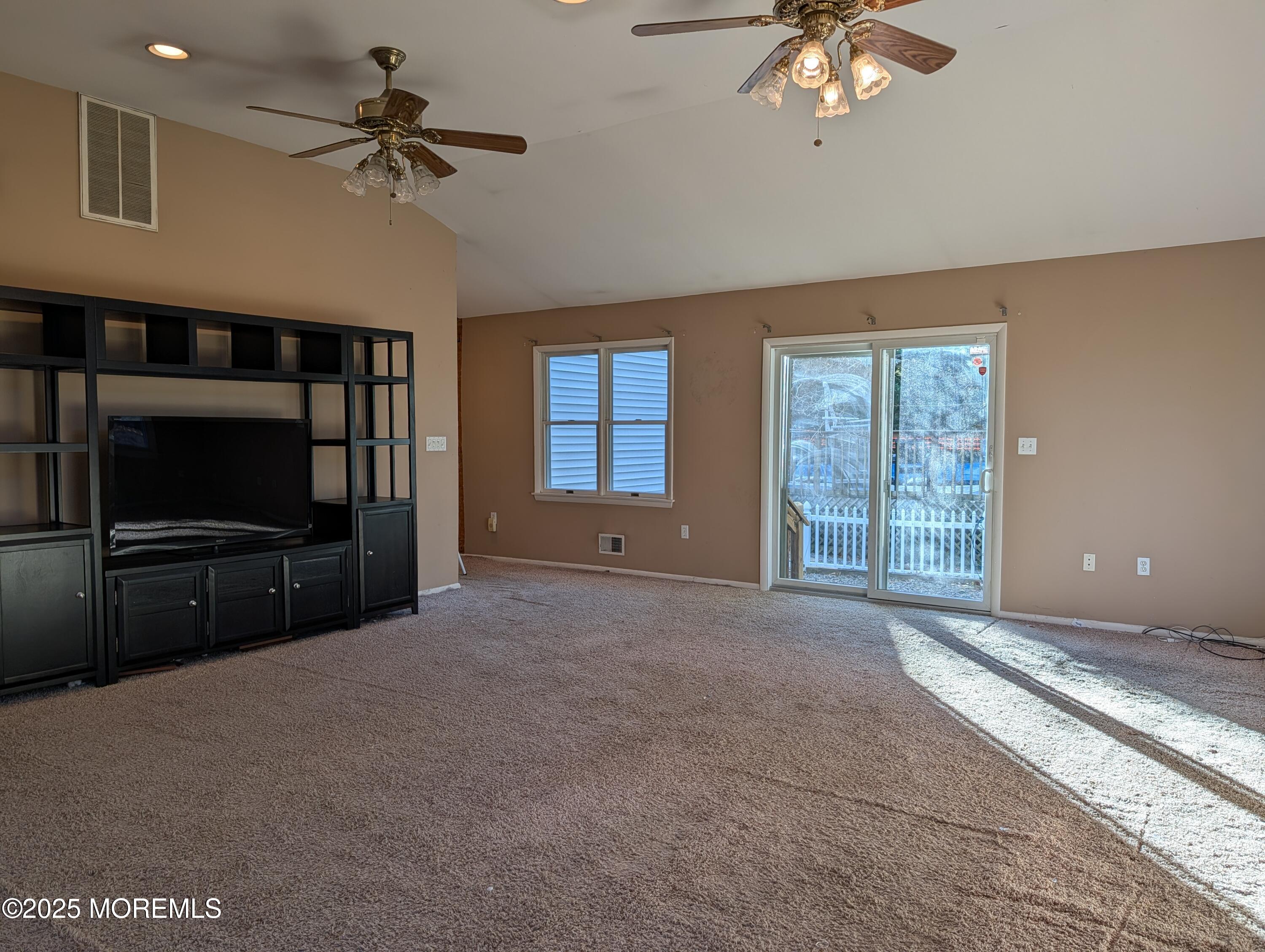 318 Eleanor Road Forked River, NJ 08731 - Photo 13 of 13 a living room with furniture a flat screen tv and a window