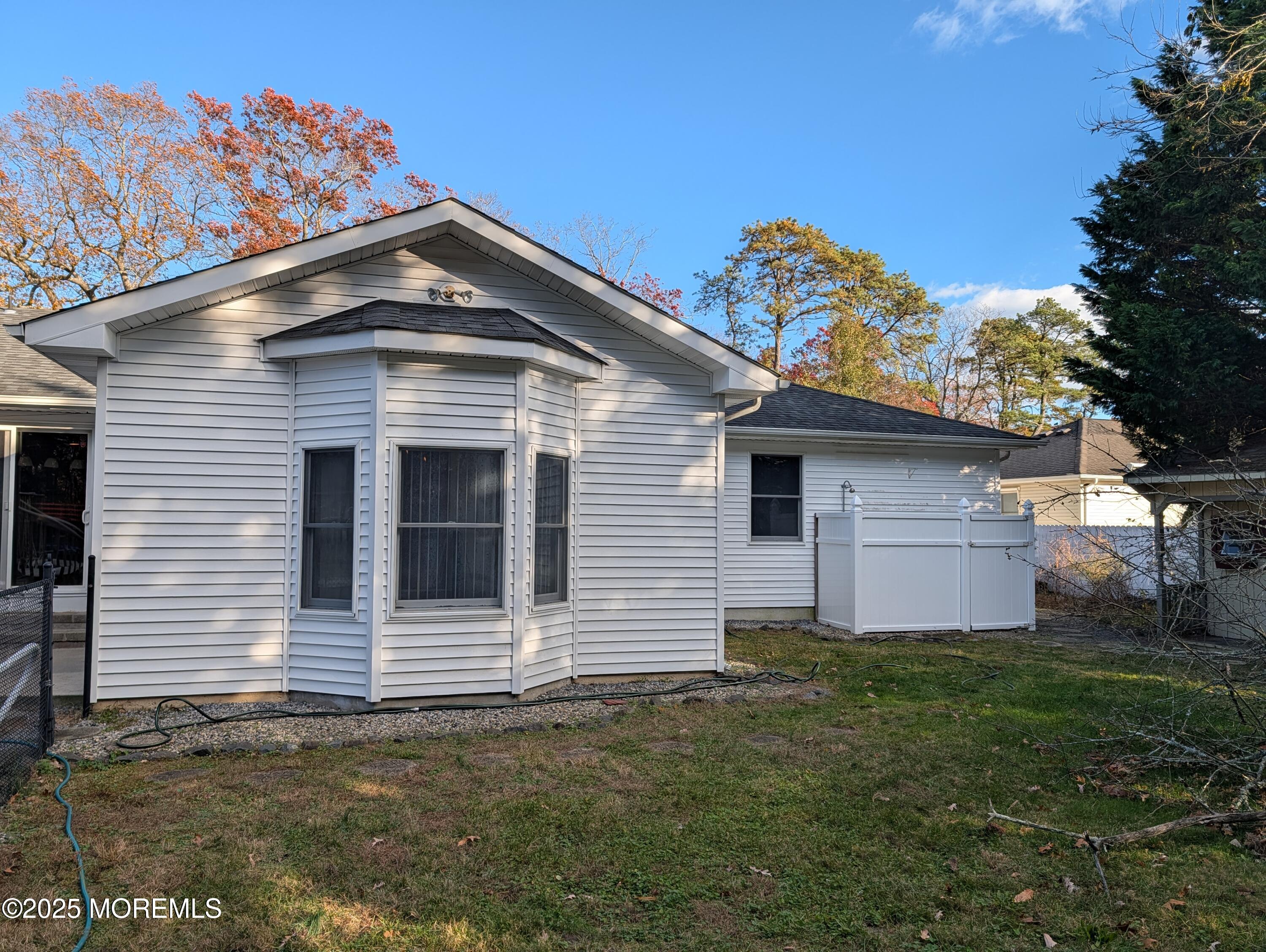 318 Eleanor Road Forked River, NJ 08731 - Photo 4 of 13 a front view of a house with garden