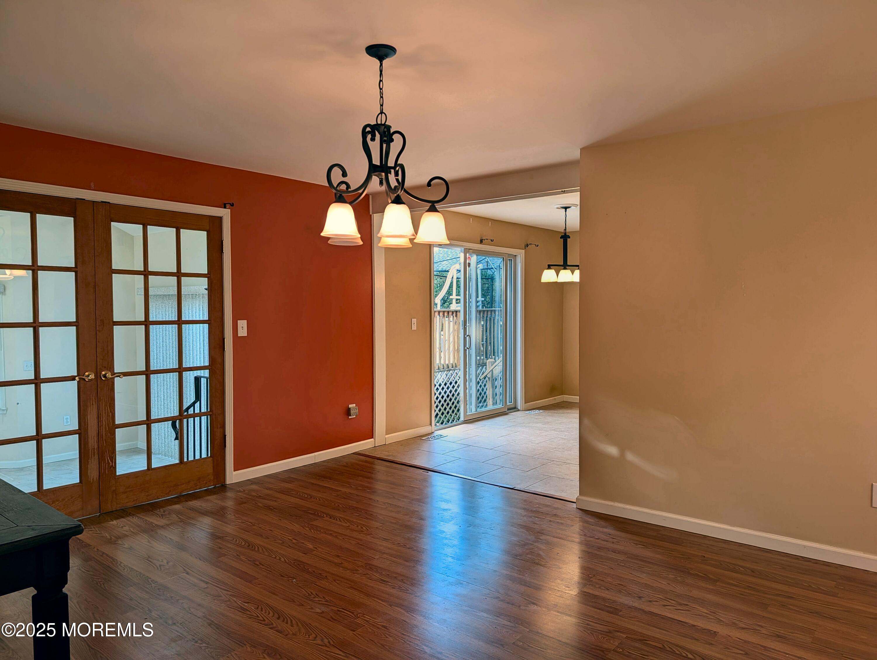 318 Eleanor Road Forked River, NJ 08731 - Photo 8 of 13 a view of a livingroom with a hardwood floor and a ceiling fan