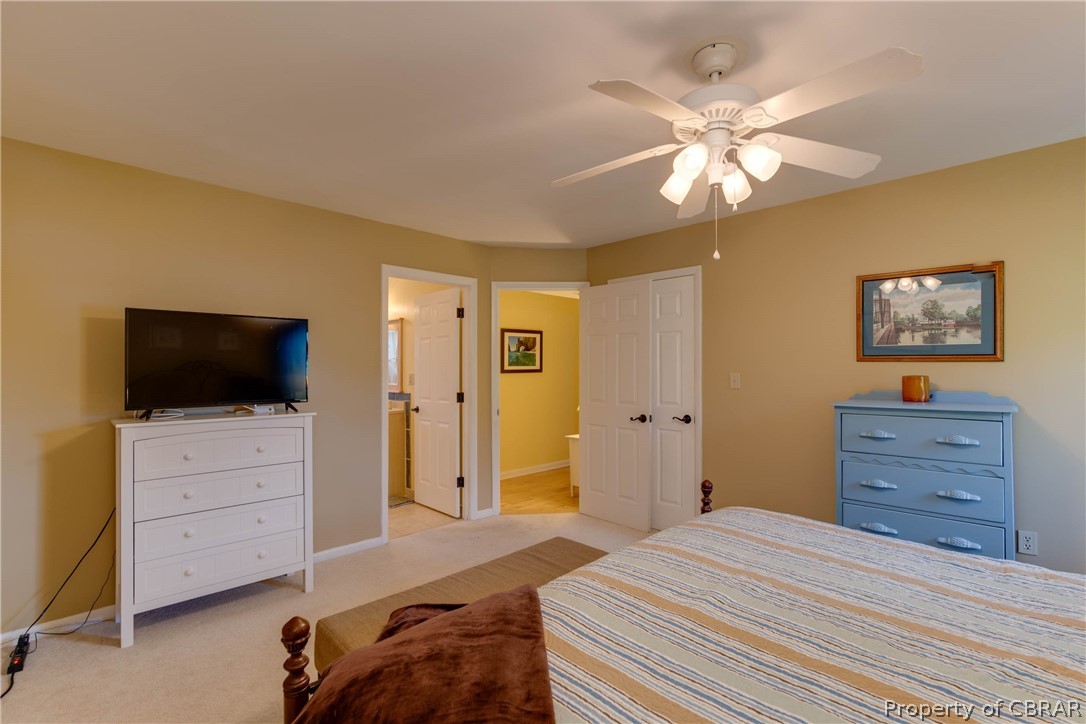 351 Reeves Road Hudgins, VA 23076 - Photo 22 of 41 a bedroom with a bed and a television