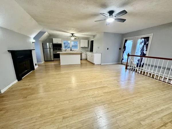 a view of kitchen and dining room with wooden floor