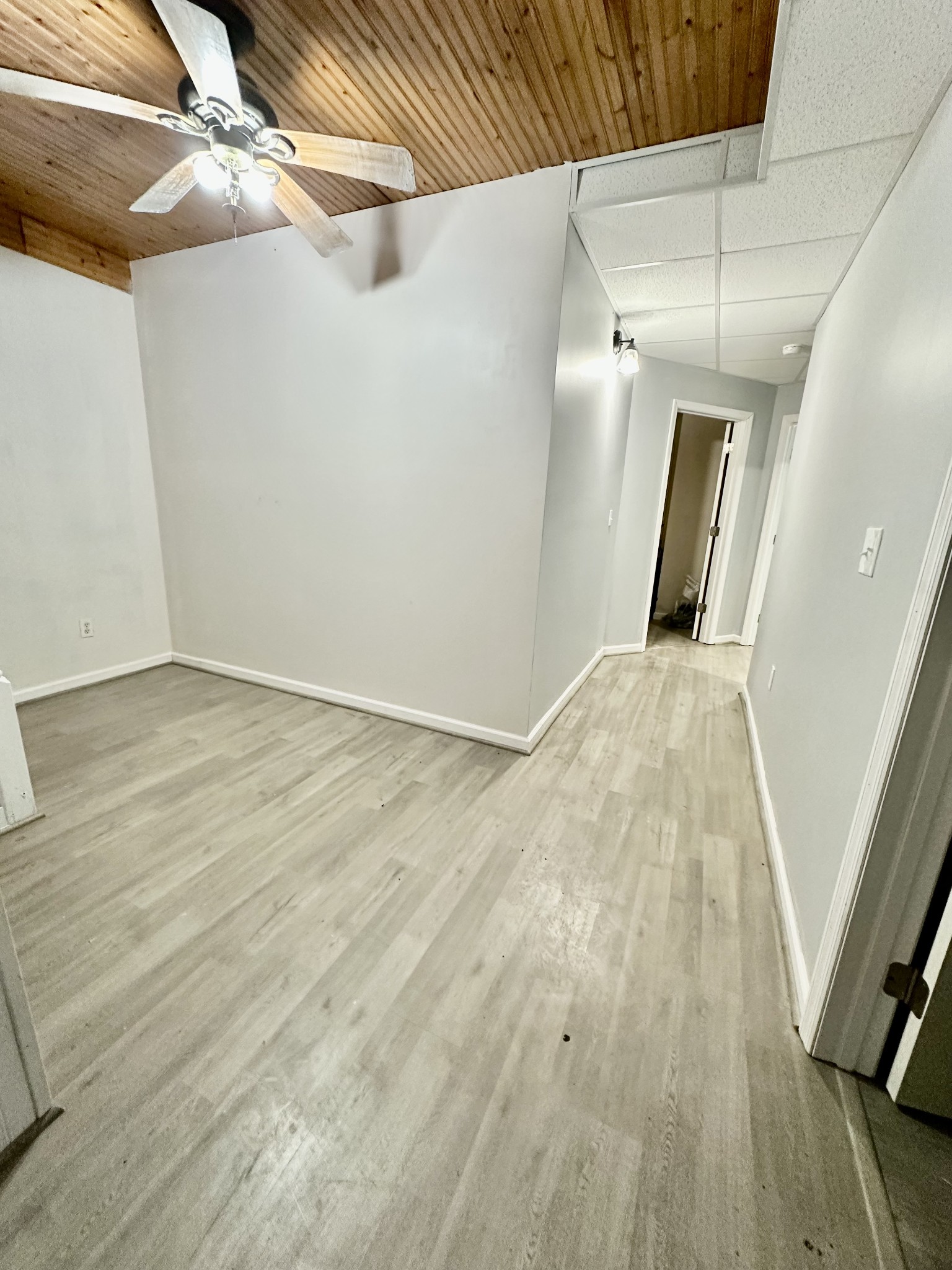 4036 Vernon Creek Road Cunningham, TN 37052 - Photo 12 of 26 a view of an empty room with wooden floor