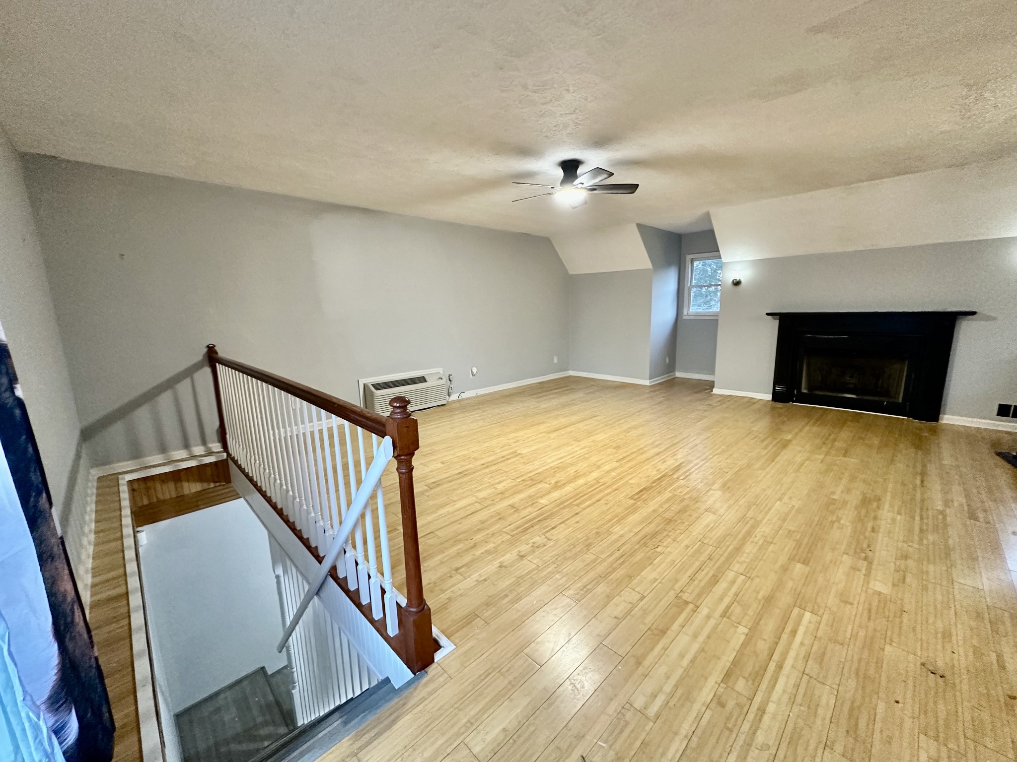 4036 Vernon Creek Road Cunningham, TN 37052 - Photo 4 of 26 a view of empty room with wooden floor and fan