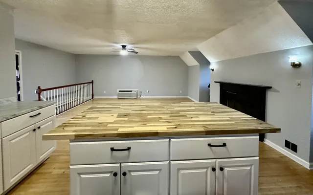 a view of kitchen and dining room with wooden floor