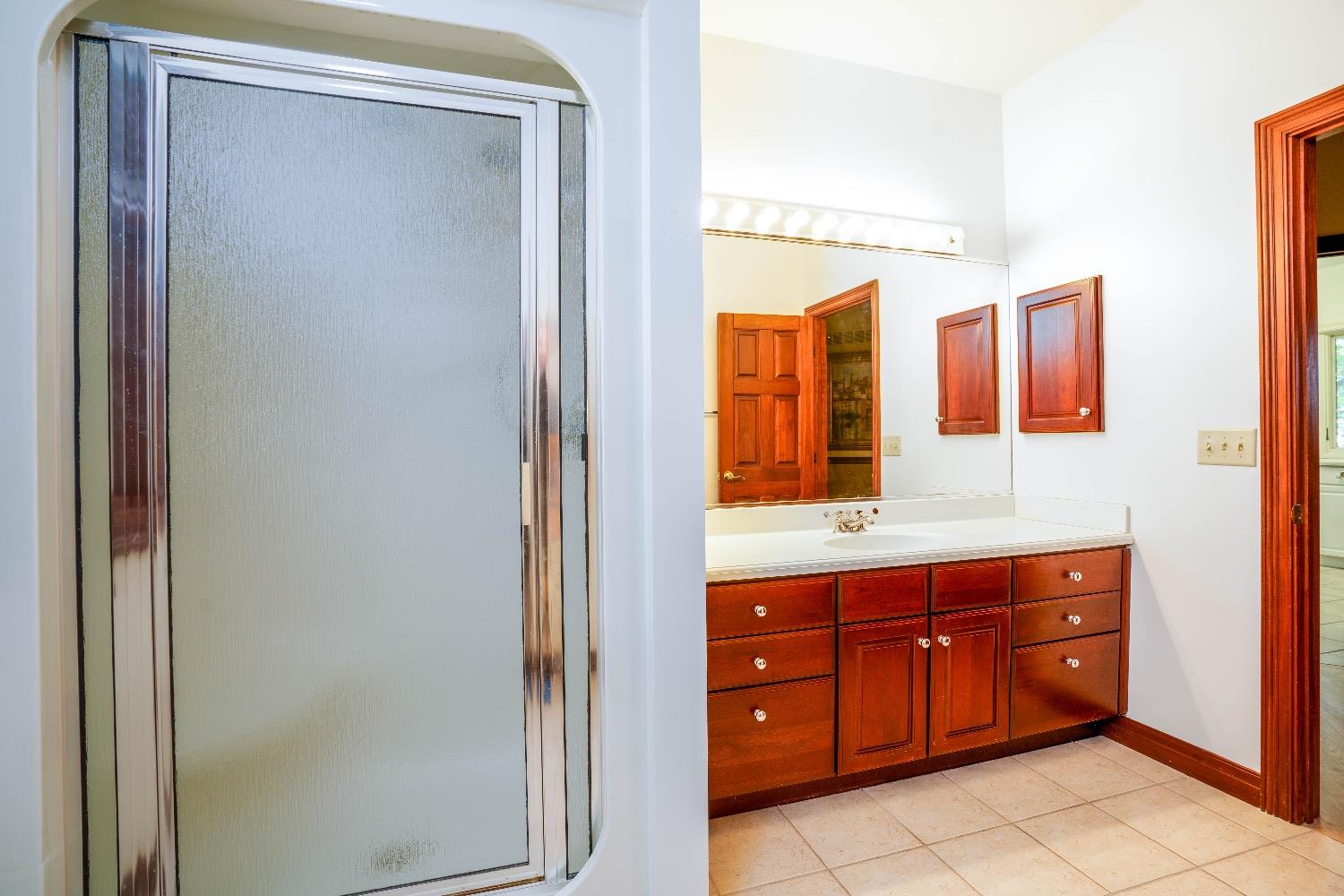 388 Deer Ridge Road Valparaiso, IN 46385 - Photo 12 of 35 a bathroom with a double vanity sink and mirror