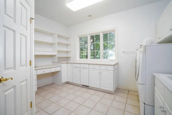 a room with a stove and a refrigerator